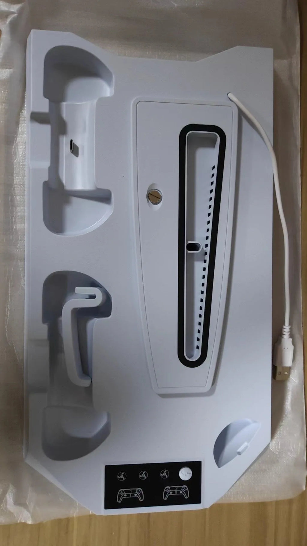 PS5 charging base radiator in black or white with controller charging ports and headset storage hook