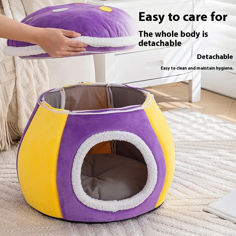 Grey mushroom-shaped plush cat bed with a detachable blanket, shown on a wooden floor.