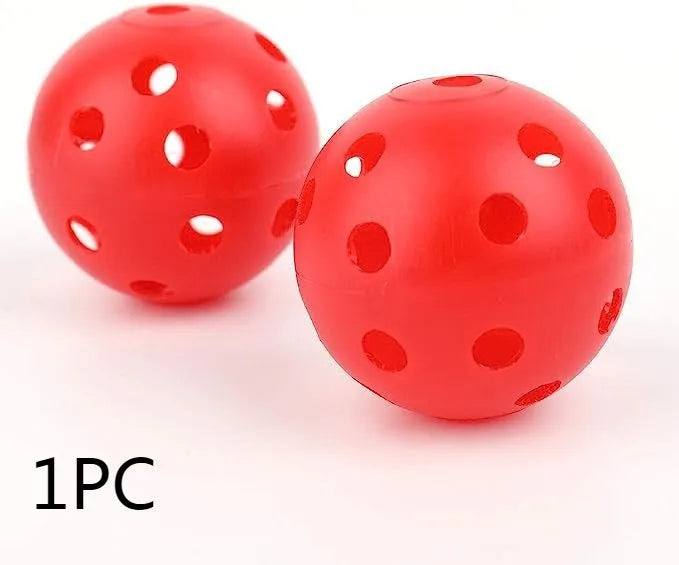 Multi-colour golf practice balls in net bag with 26-hole putting layout for skill development