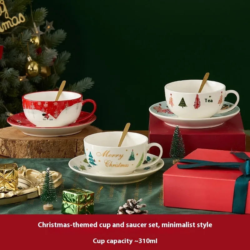 Ceramic gold-plated Christmas teapot set with snowflake design, including pot on dish and cup on dish with spoon, in gift box.