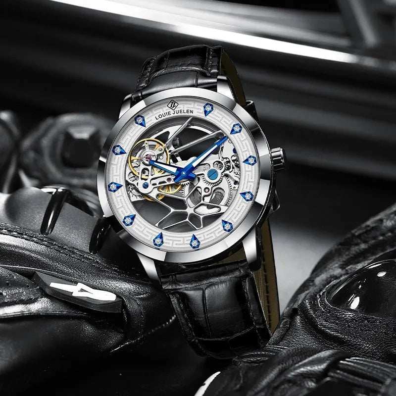 Men's silver mechanical watch with white dial, blue hands, and black genuine leather strap