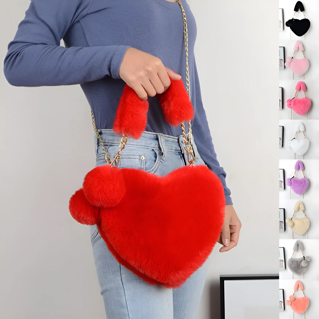 Soft plush heart-shaped women's handbag in a medium size with a removable shoulder strap.