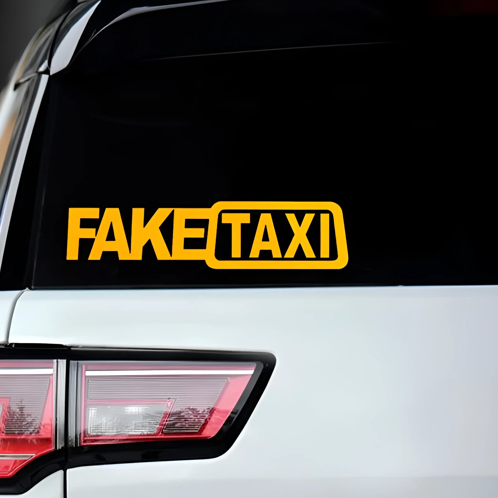 FAKE TAXI car warning sticker in black, white, and yellow, measuring 20cm by 8cm.