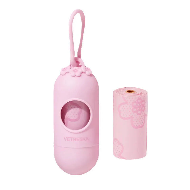 Portable plastic capsule dispenser for scented dog poo bags in strawberry, orange, and cherry blossom designs.