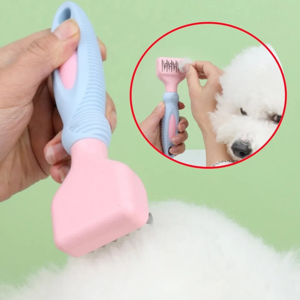 Pink dual-ended pet grooming brush with stainless steel knot knife and massage pins on a white background