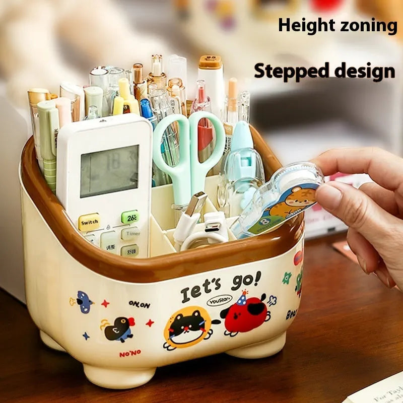 Red and brown cartoon sticker designs on a plastic desktop storage box with grid organiser compartments.