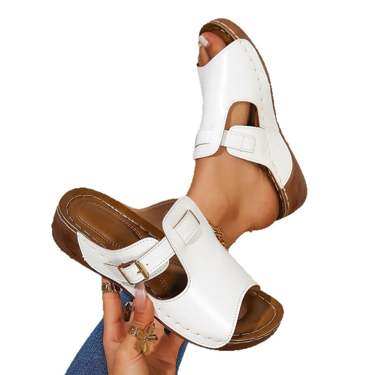 Women's white Roman magic stick slipper shoe with fish mouth toe and EVA sole.