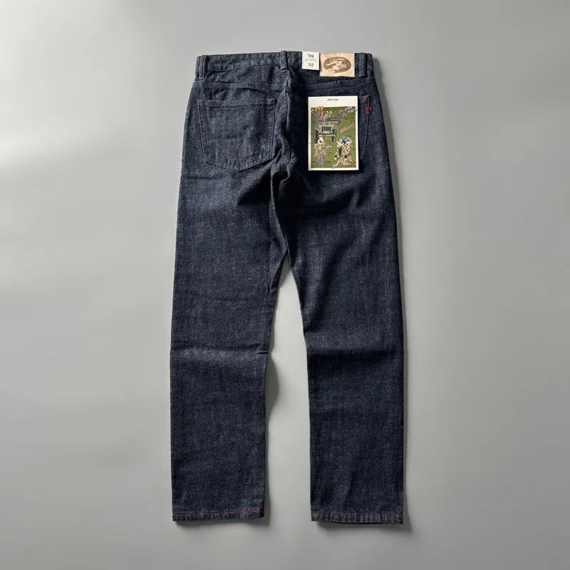 Men's primary blue straight-leg cotton denim trousers on a neutral background, showing mid-waist fit and trouser length.