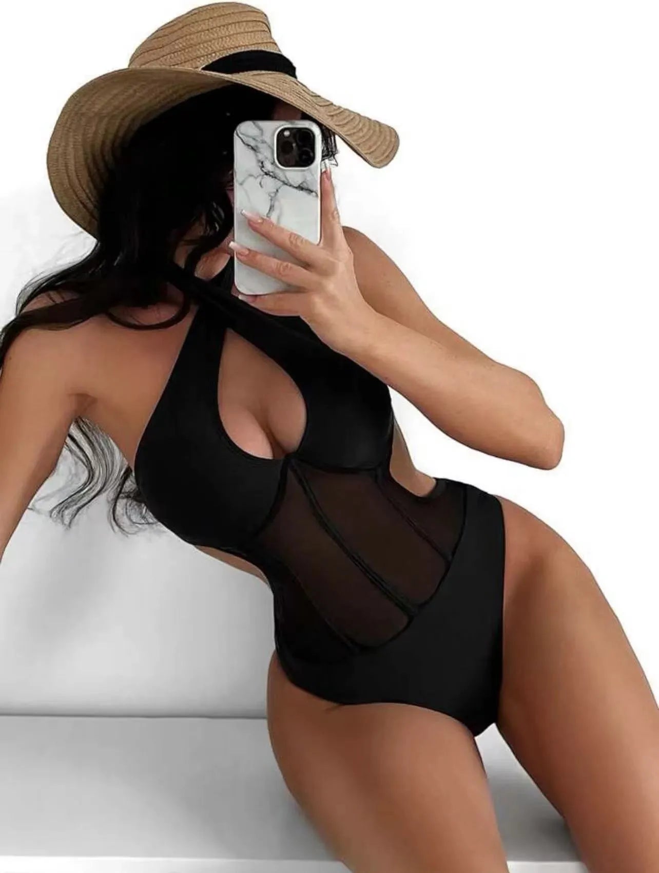 Women's black one-piece swimsuit made from nylon and spandex fabric on a neutral background.