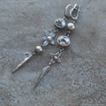 Geometric antique silver long drop earrings with rhinestones and a XINGX design motif.