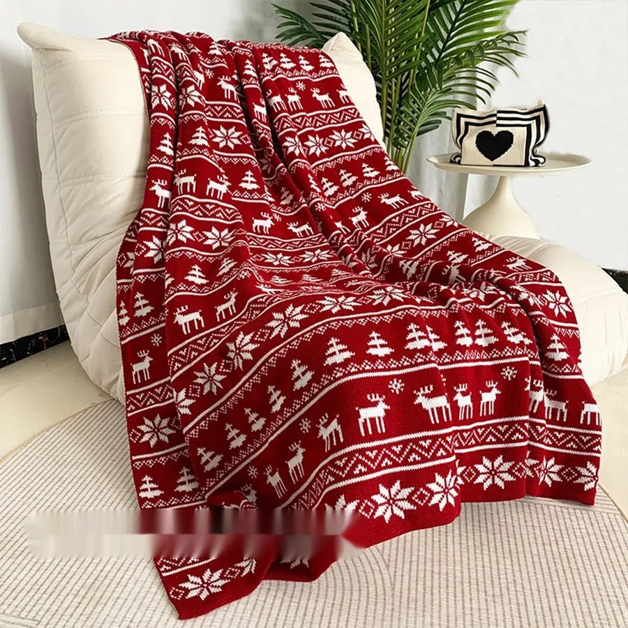 Christmas blanket with cartoon snowflake design in red and white colours