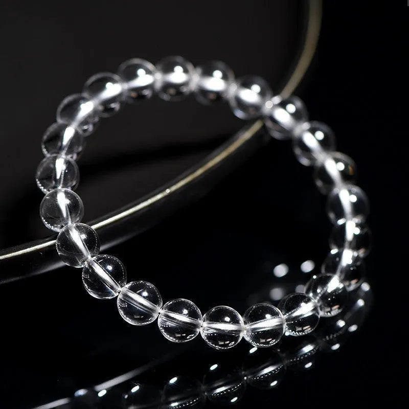 Natural Donghai old materials white water round crystal bracelet with geometric design on wrist.