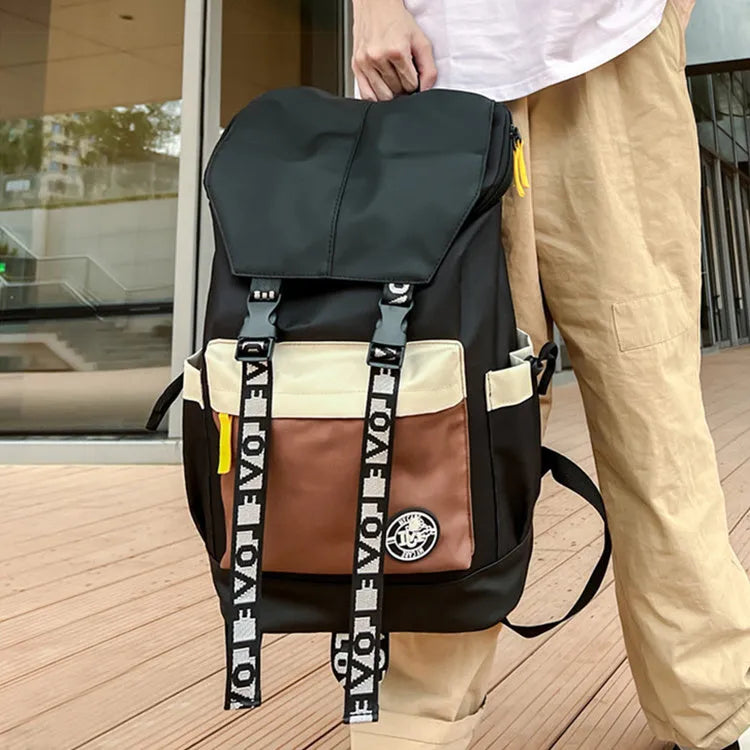Oxford cloth school backpack showing three carrying methods with 32cm width dimensions
