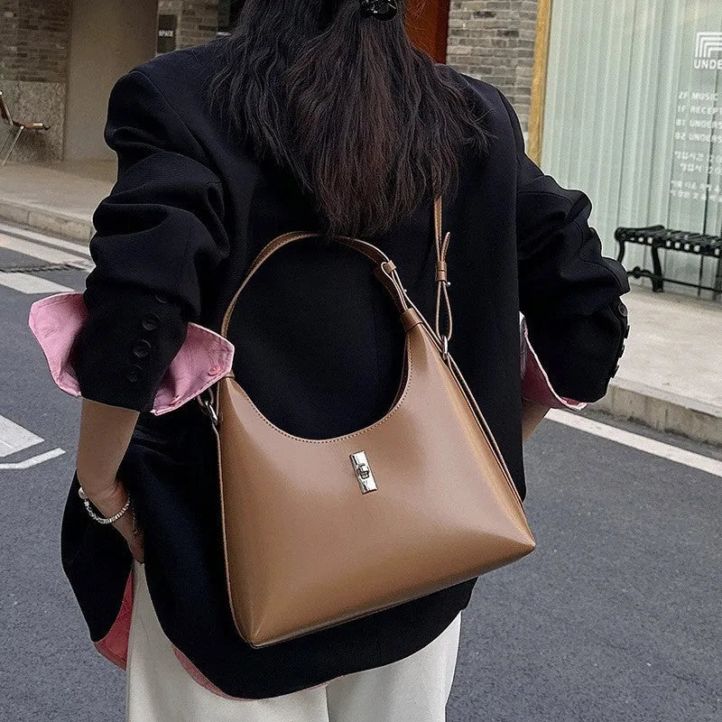 Genuine leather dumpling-shaped crossbody bag in apricot colour with shoulder strap