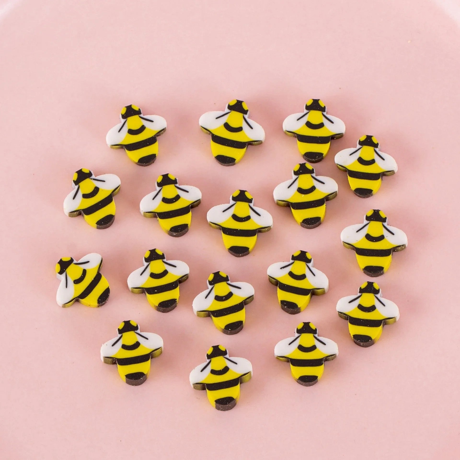 Assortment of fifty small cartoon-shaped rubber erasers in fruit and animal designs.