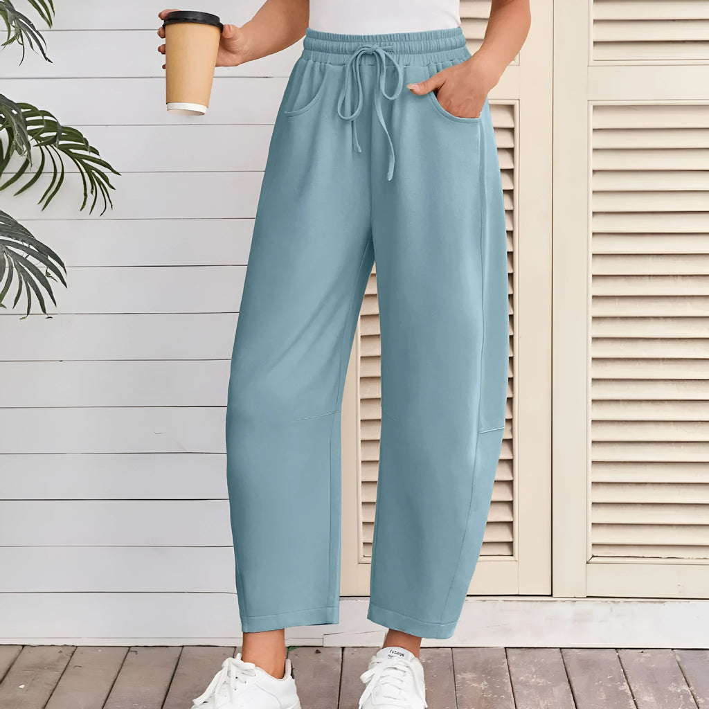 Loose cropped sweatpants with elastic drawstring waist in cotton fabric, shown in multiple colour options