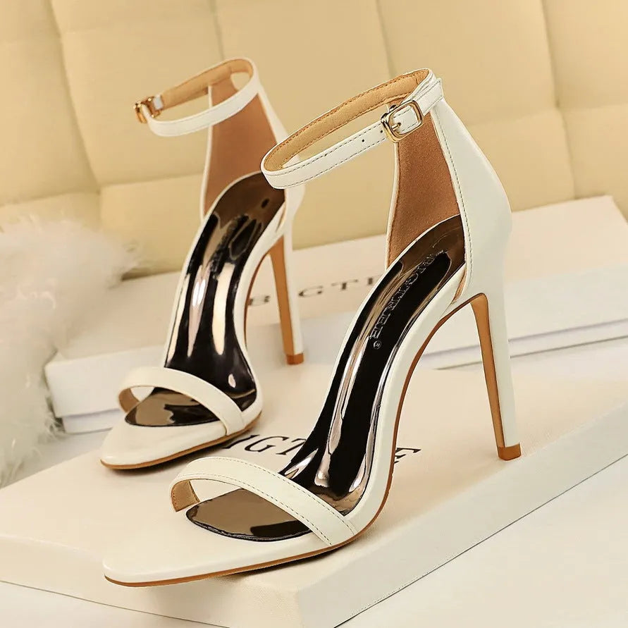 Women's open toe high heels with an ankle strap buckle in six colour options.