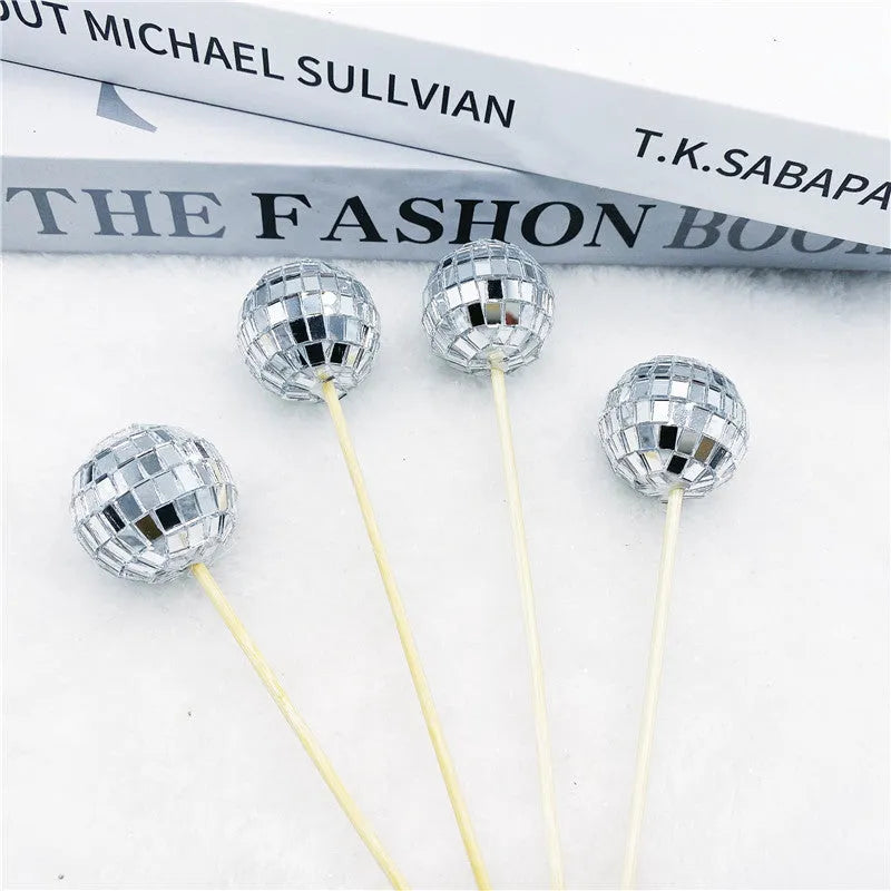 Glass disco ball cake decoration on wooden stick available in four sizes from 2.5cm to 5cm diameter