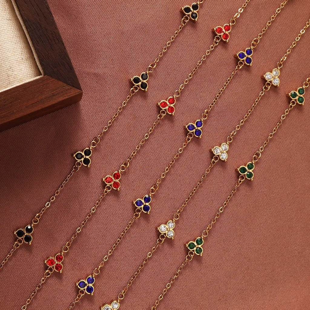 Geometric triangular stainless steel women's bracelet with coloured zircon stones in gold or steel finish.
