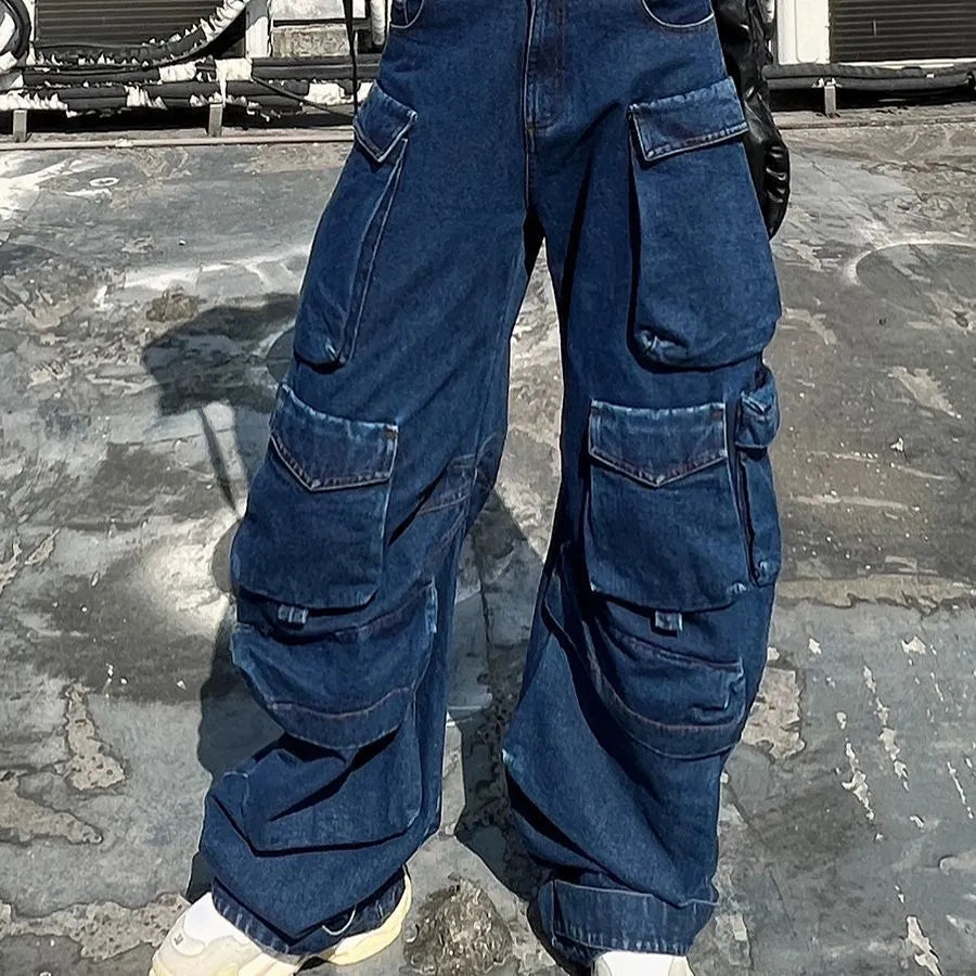 Dark blue distressed wide-leg jeans with a high waist and multiple pockets on a mannequin.