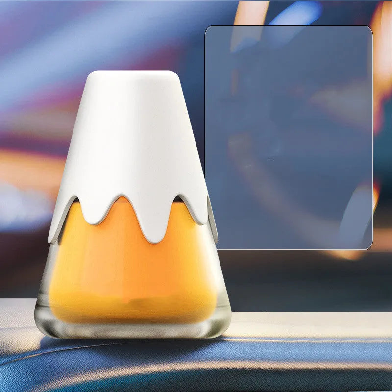 Glass jar car air freshener in choice of scents on a car dashboard.