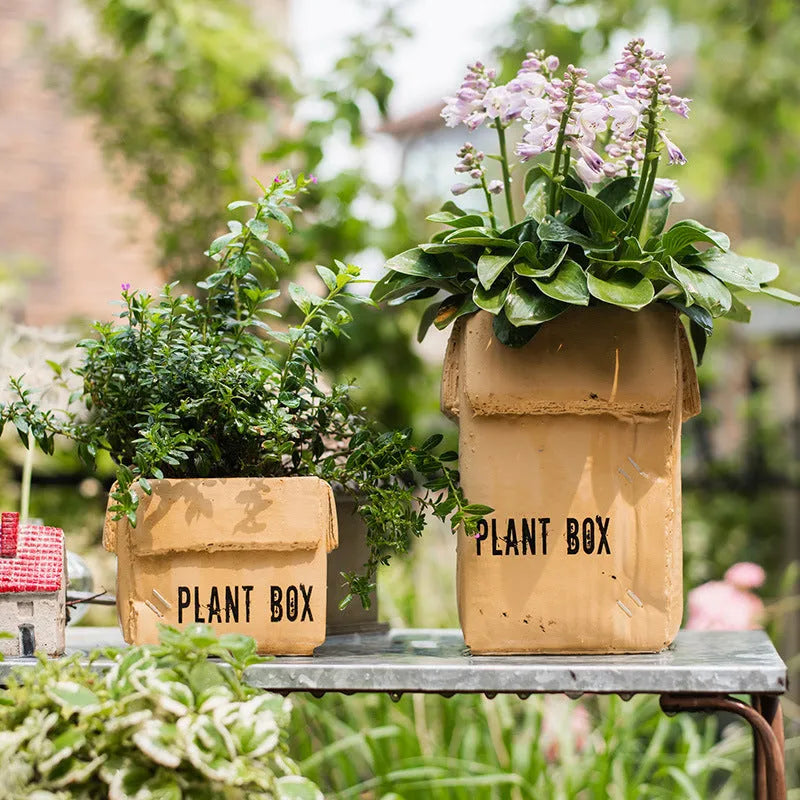 Cement flowerpot with bottom drainage holes and paper box texture in Nordic style design