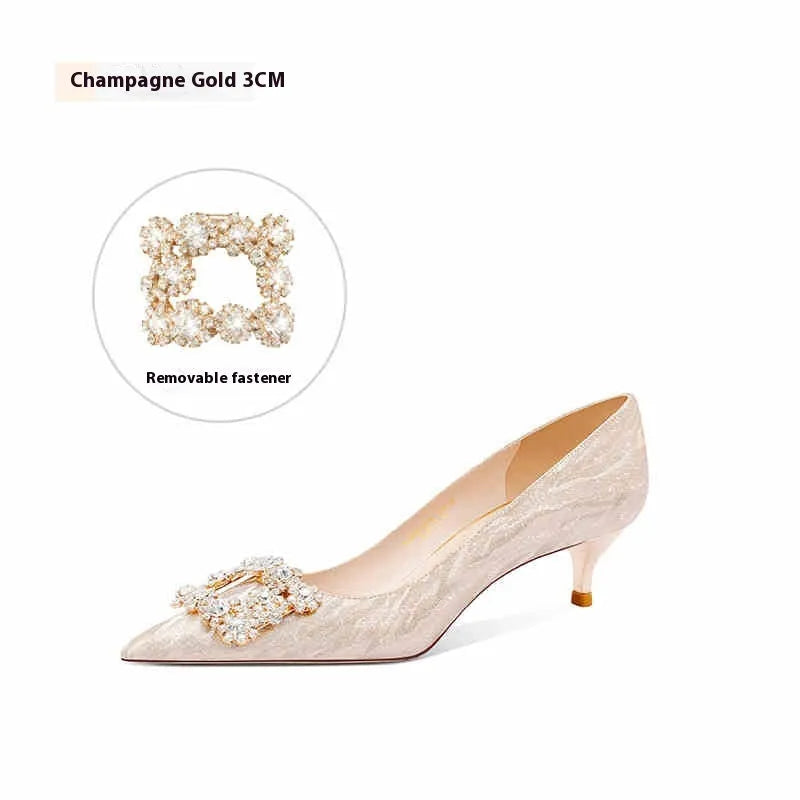 Champagne gold pointed-toe stiletto high heels with rhinestone decoration.