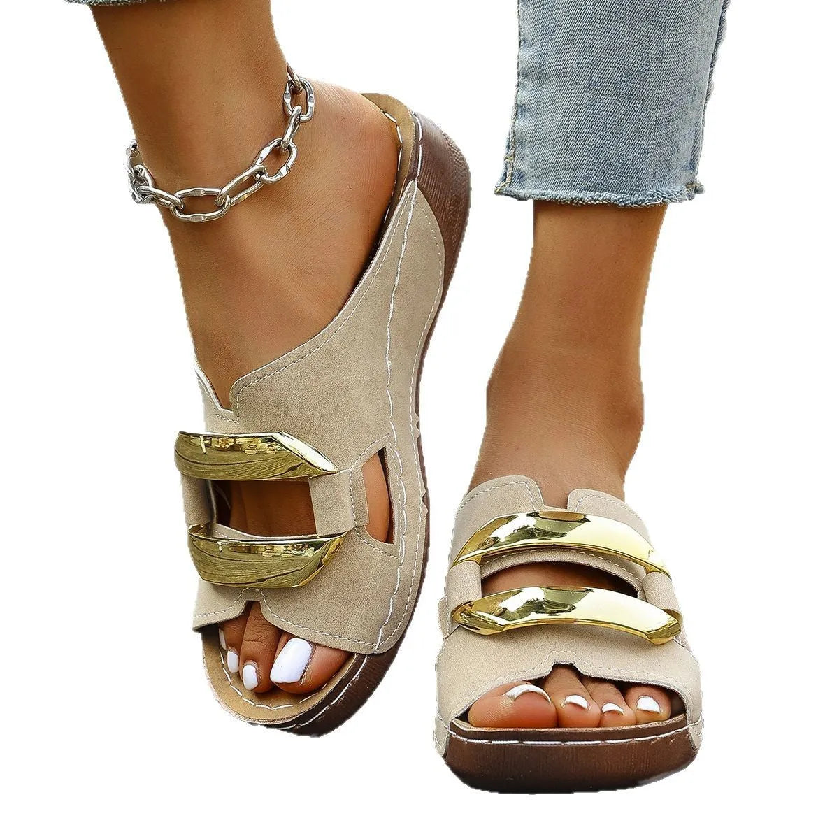 Roman-style platform flip-flop sandals in white, showing flat heel and metal detail.