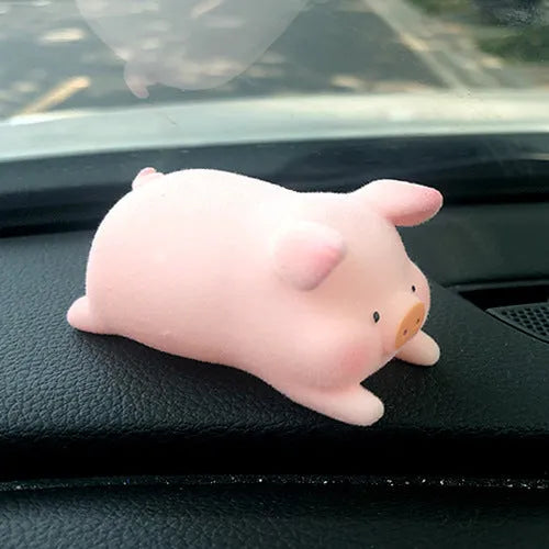 Cartoon pig character resin car ornament for dashboard or windscreen decoration.