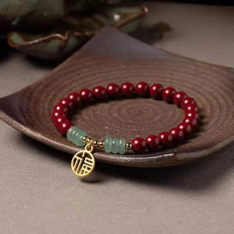 Handcrafted Chinese cinnabar bracelet with gold copper beads in wave design on wrist