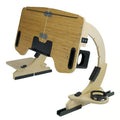 Wooden folding computer table on bed showing adjustable angle feature