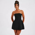 Women's solid colour backless tube dress with A-line skirt and high waist in various colours.