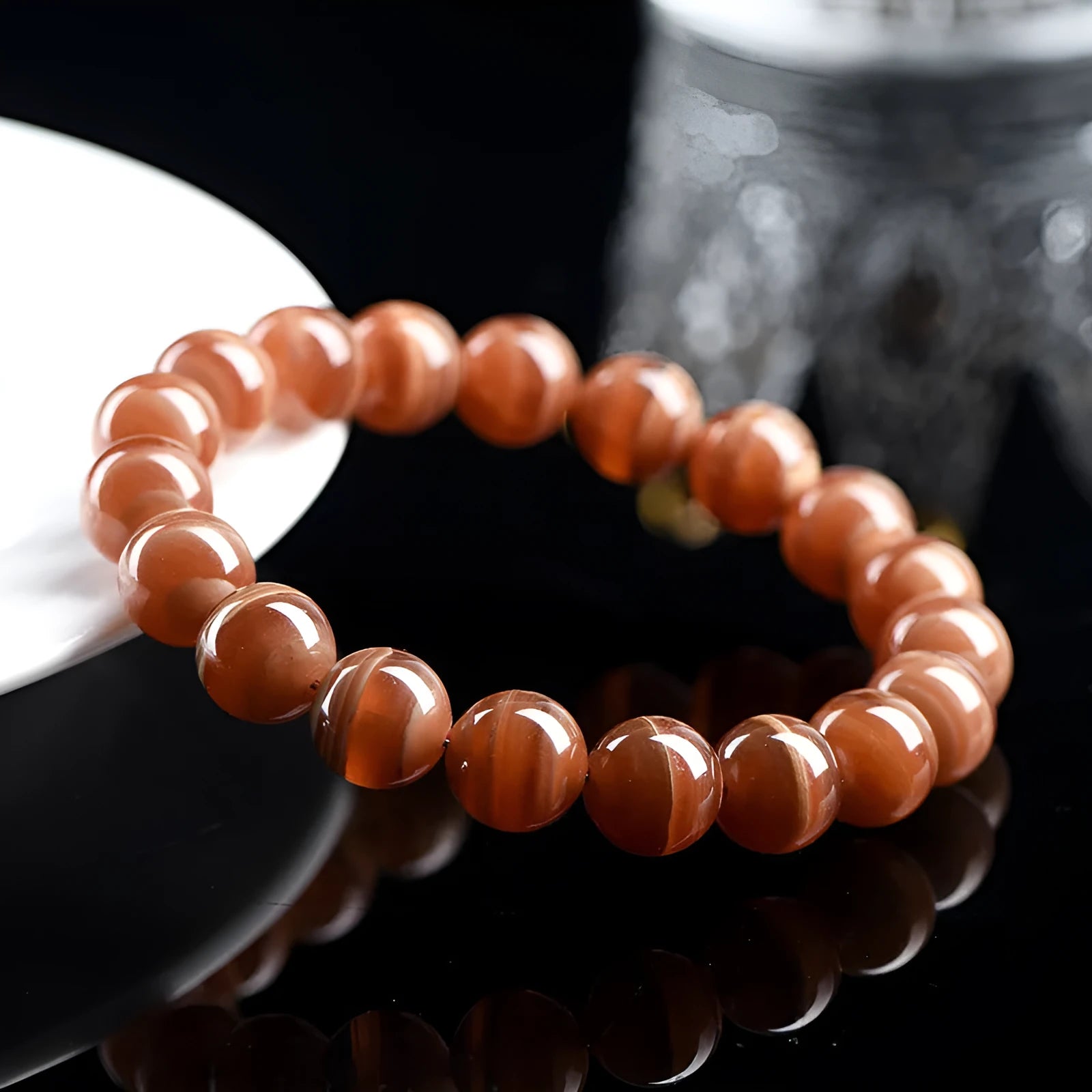 Natural Rhodochrosite round beads bracelet from Peru with geometric design and Ruyi elements