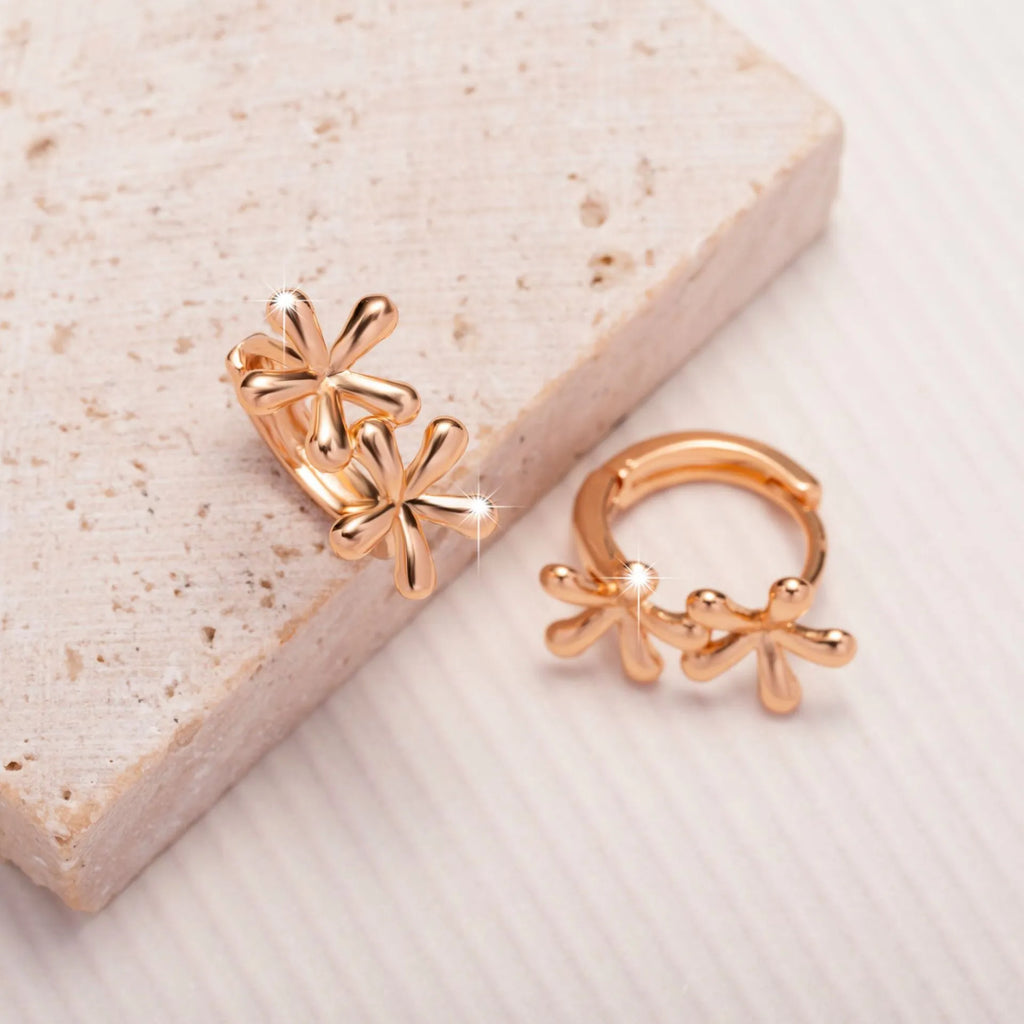 Circular rose gold earrings featuring a waterdrop flower design for women.