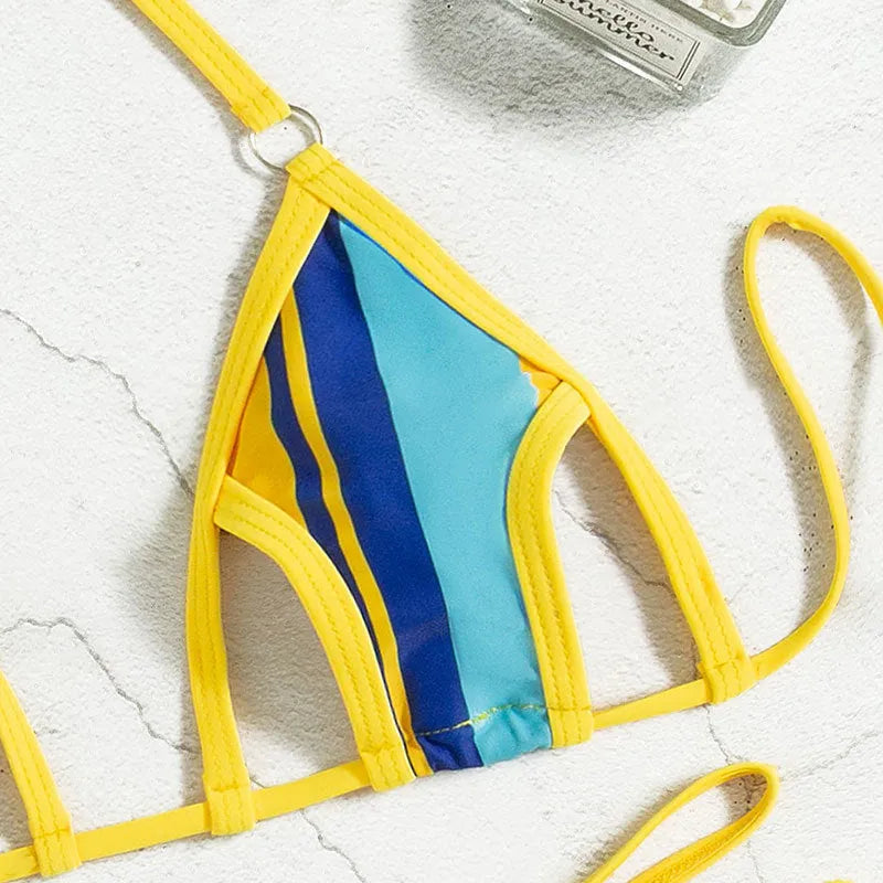 Yellow women's high-waist hollow-out backless swimsuit bikini set on a neutral background.