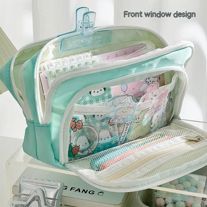 Double layer pencil case in blue, pink, green or cream with gift handle and 215x135x85mm dimensions