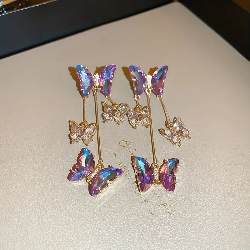 Silver needle crystal flowers butterfly tassel earrings in blue purple colour with electroplated alloy construction