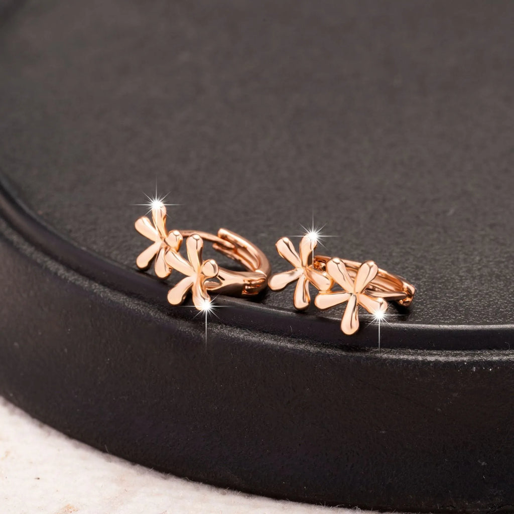 Circular rose gold earrings featuring a waterdrop flower design for women.