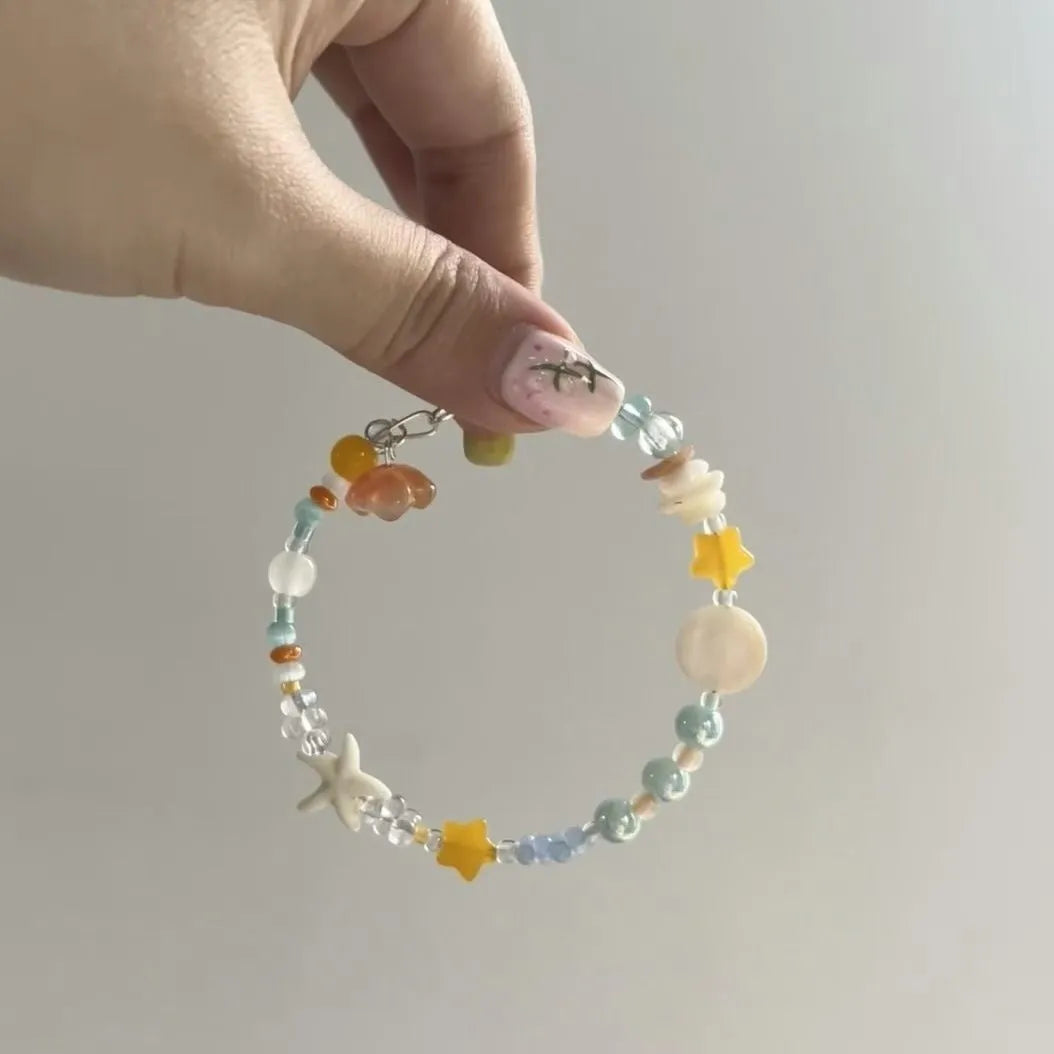 Women's alloy bracelet with diamond shape design in water-soaked orange seaside colour