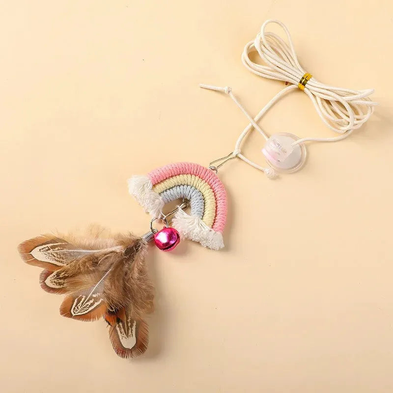 Blue feather cat toy hanging from door with elastic rope and sticky buckle clamp for interactive play