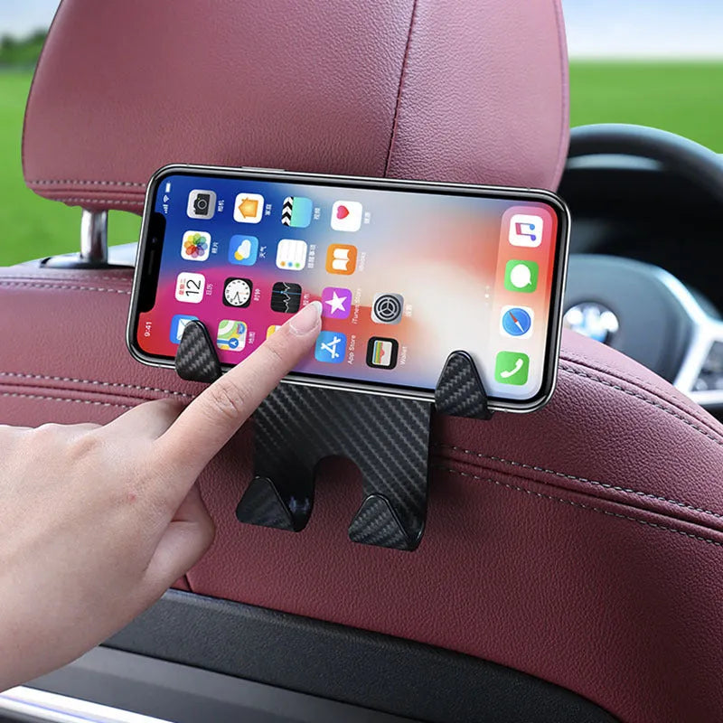Black ABS car multifunction hook with carbon fibre pattern and integrated phone bracket for rear seat storage.