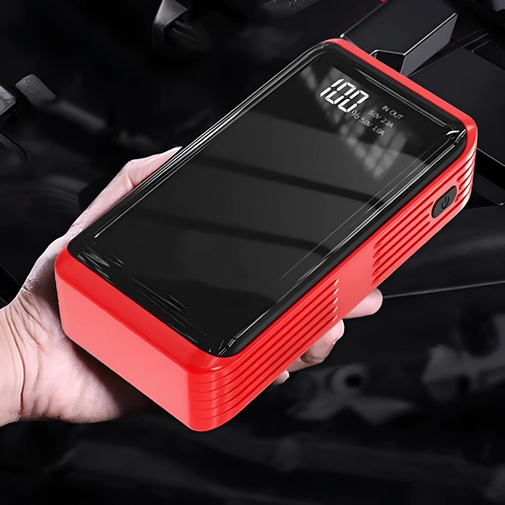 TM48 1200A car jump starter with battery clips, LED light, and USB port on a dark background