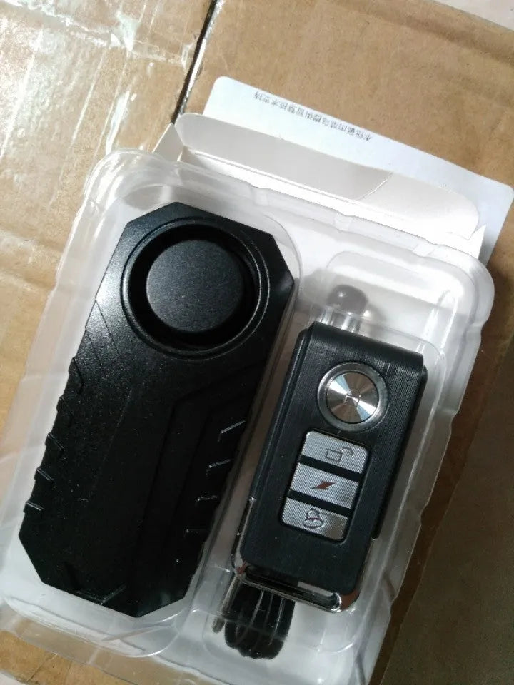 Elecpow bike alarm remote control in black with waterproof IP55 case and vibration sensor mounted on a bicycle frame