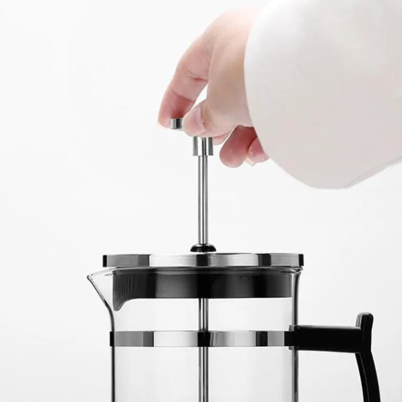 Compact glass and stainless steel coffee maker with 350ml capacity and pour-over design