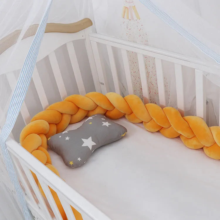 Baby crib bumper braid knot pillow cushion in spandex velvet, shown in a light grey colour
