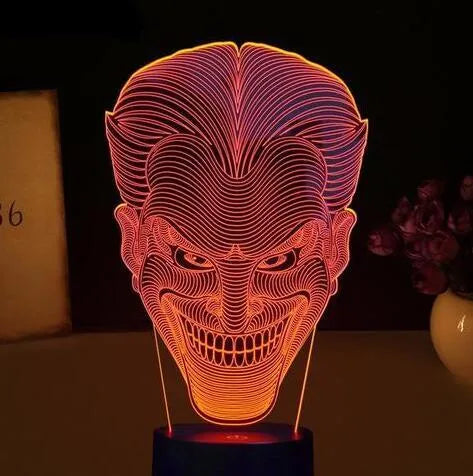 USB-powered 3D acrylic LED lamp showing colourful gradient illumination on a desk.