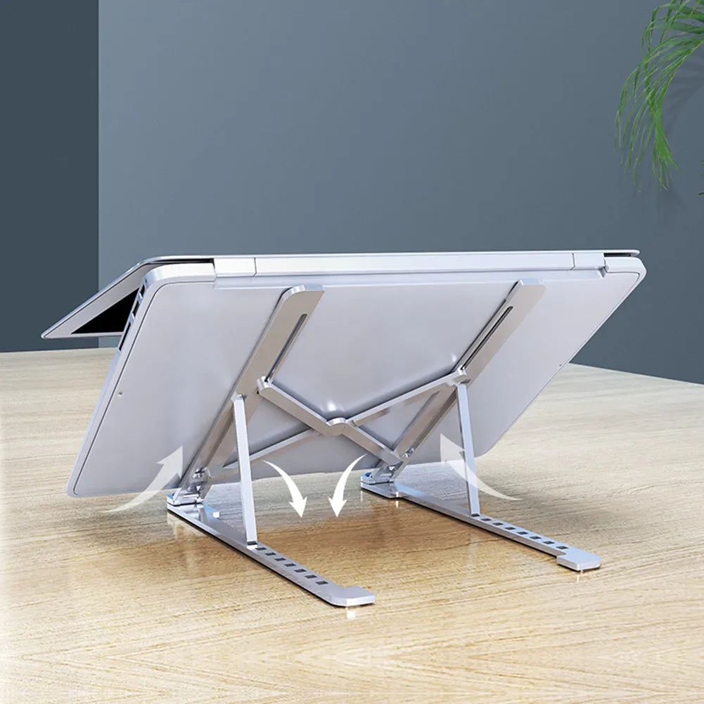 Foldable aluminium laptop stand in silver showing adjustable height mechanism and compact folded size
