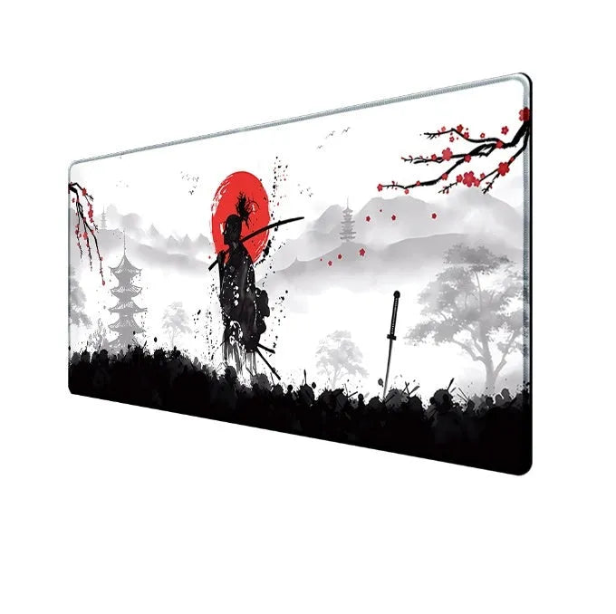 Japanese samurai design gaming mouse pad with cloth surface on a desk.
