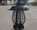 Black solar-powered mosquito lamp with solar panel on top and 24 LED lights for outdoor garden insect control.