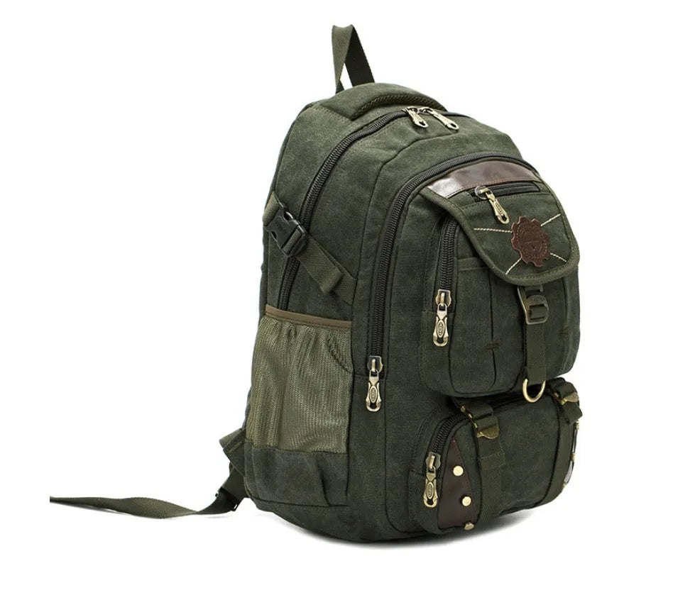 Canvas computer backpack in black with square vertical shape, zip closure, and multiple pockets